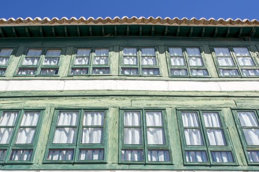 A low angle shot of the facade of the buildings of La Plaza Mayor in the town of Almagro, Spain