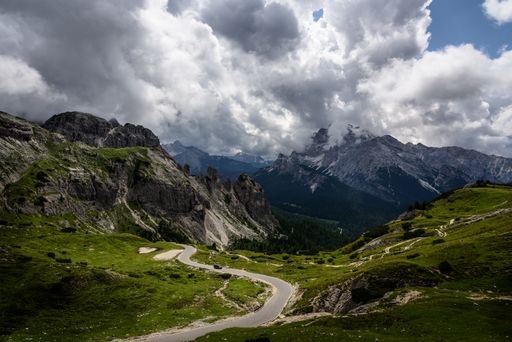 A scenic view of a path to Tre Cime di Lavaredo in the north of Italy against a cloudy sky