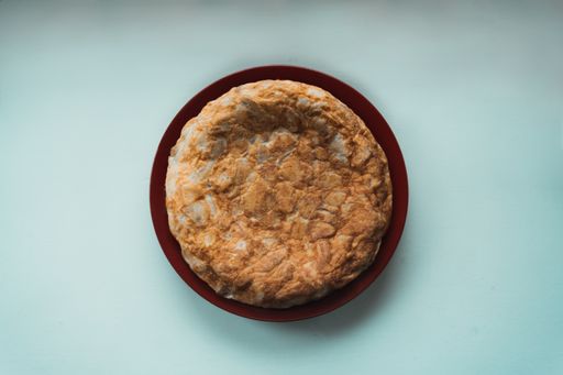 A top view of delicious Spanish omelette on a plate
