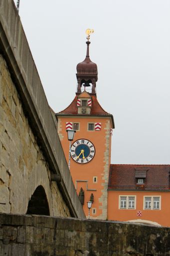 A vertical shot of a church under the cloudy skies