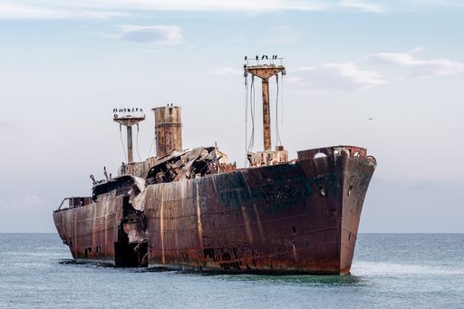 A beautiful shot of an old ship under the cloudy skies