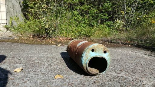 A worm pipe laying on the ground in Chernobyl, Ukraine