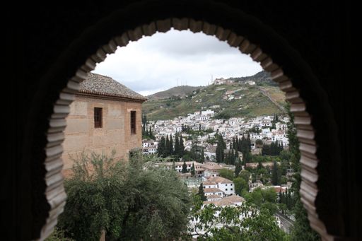A view of Granada, Spain through an arch window