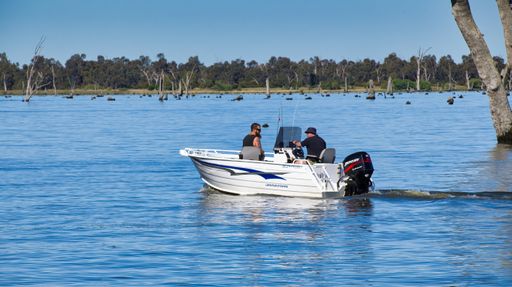 The two fishermen in their boat crossing Lake Mulwala looking for a place to fish