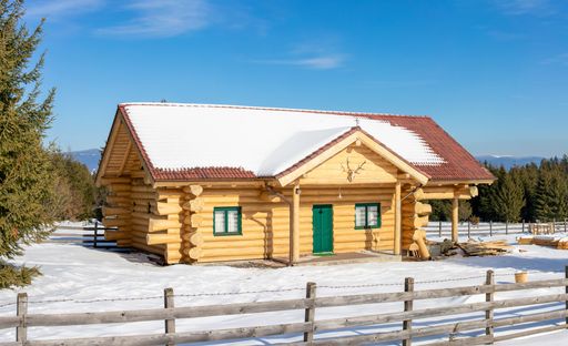 A house made of wooden beams in the mountains
