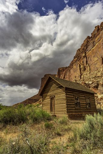 A historic schoolhouse in Fruita near Capitol Reef National Park under the cloudy sky