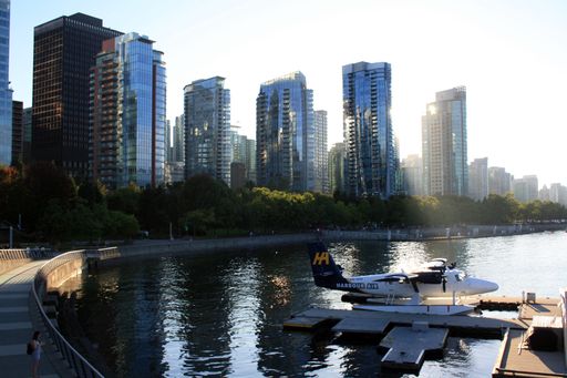 A view of the parked seaplane and modern buildings in Vancouver Harbor, British Columbia, Canada