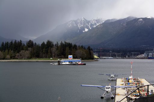 A view of the parked seaplanes on a gloomy day in Vancouver Harbor, British Columbia, Canada