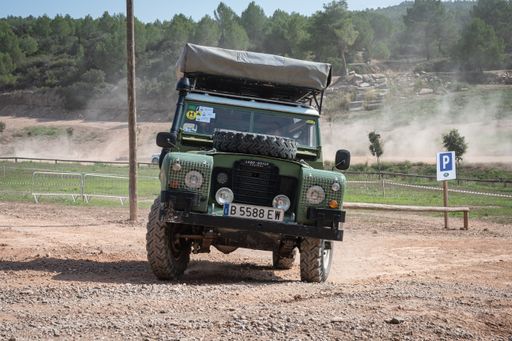 The Vintage Land Rover Santana Series III in green with a tent on the roof rack