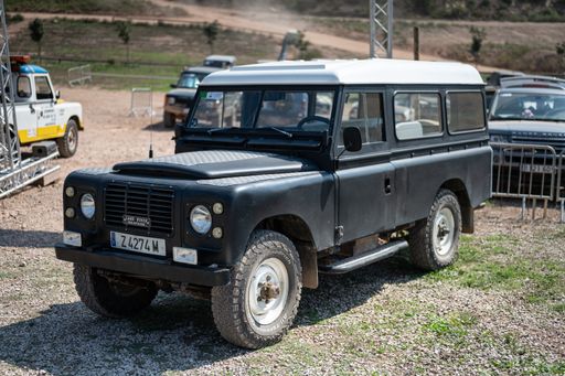 A close-up shot of black Land Rover Santana Series III Long in field