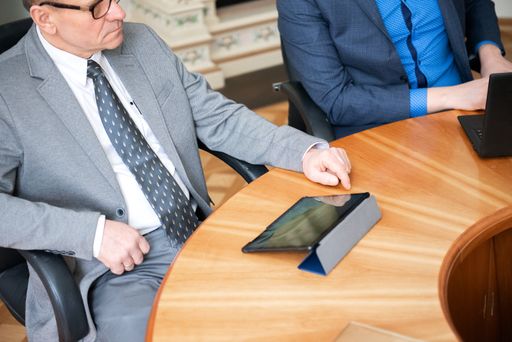 Roundtable meeting of business partners. Young business people team using laptops computers.