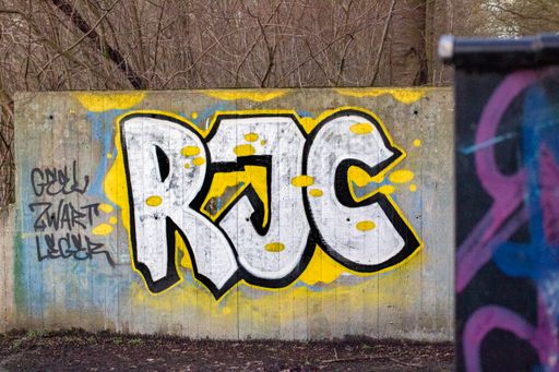 A closeup shot of a graffiti on a wall of a football club named Roda JC