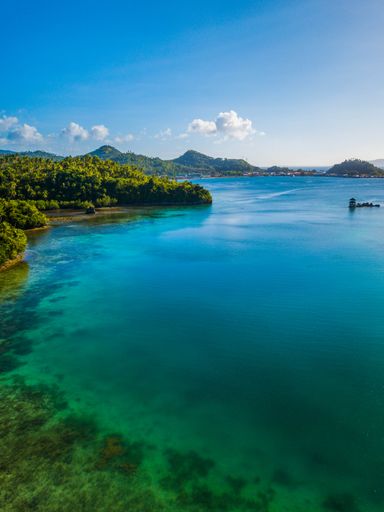 A beautiful view of the Ishigaki lake shore near islands on a sunny day