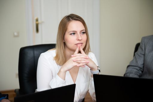 Portrait of a thoughtful young woman during a business meeting
