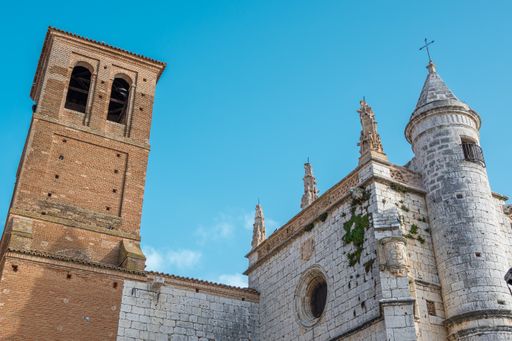 A perspective shot of the church and bell tower of San Antolin in Tordesillas, Italy.