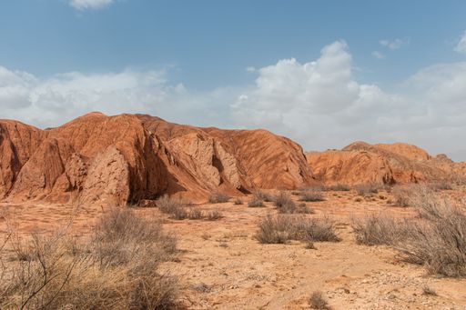 A desert with mountains background on a sunny day in the west of China