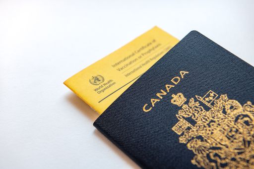 A Canadian passport with a world health organisation vaccine passport