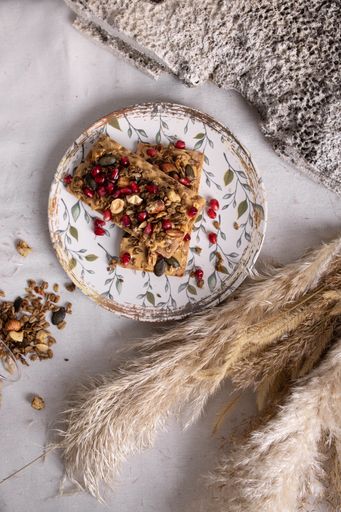 A Top view of a  plate of granola with fruits and white yogurt, breakfast idea