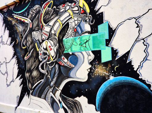 A closeup of a futuristic themed mural on a wall
