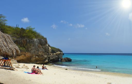 A sunny view of a paradise beach on the Curacao island and the Caribbean sea