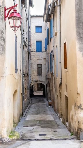Sommieres, medieval village in France, view of typical street and houses