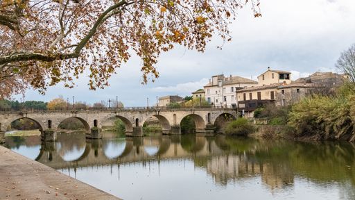 Sommieres, medieval village in France, view of the roman bridge