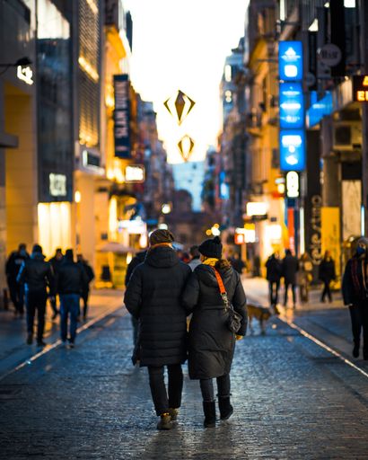 The beautiful night urban shot of a couple walking  in a street