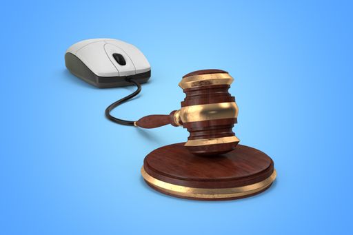 A 3D rendering illustration of a computer mouse connected to a gavel isolated on a blue background - digital internet law justice concept
