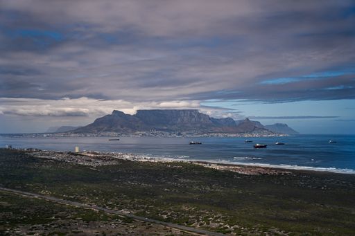 An aerial shot of a beautiful sea and Table Mountain in Cape Town, South Africa