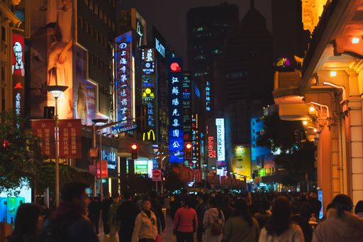 A closeup shot of people walking in the crowded shopping street Nanjing Road in Shanghai