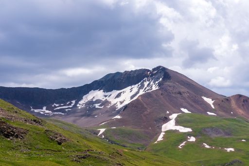 A beautiful view of the San Juan mountains under the blue partly cloudy sky