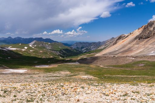 A beautiful view of the San Juan mountains under the blue partly cloudy sky