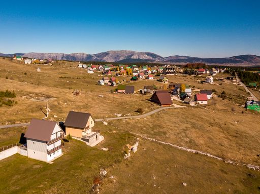 A beautiful view of a village with small houses under the blue sky