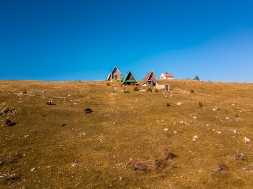 A beautiful view of a village with small houses under the blue sky