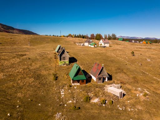 A beautiful view of a village with small houses under the blue sky