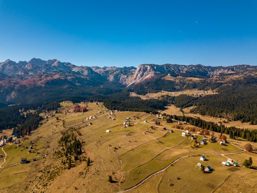 A beautiful view of a village with small houses under the blue sky