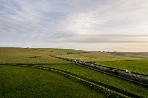 Large meadows and clear cloudy sky in South Downs National Park, Brighton, UK