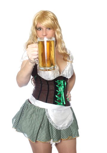 A vertical shot of a Caucasian tavern waitress with a beer mug on a white background.