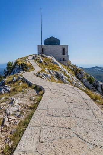 A vertical shot of the stone path leading to Njegos Mausoleum. Monument in Montenegro.