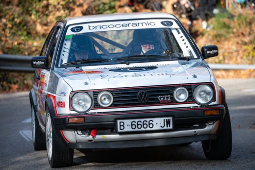 A white Volkswagen Golf GTI MKII rally car driving during the 69th Rally Costa Brava competition