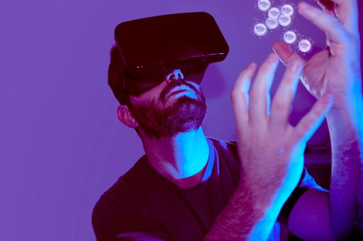 man with vr glasses receiving nft in the metaverse on lilac and dark background