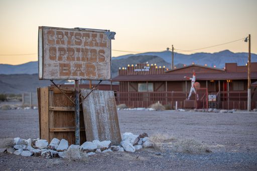 A decaying sign marks the location of the closed Crystal Springs Bar, a once popular bar and legal brothel in Nevada.