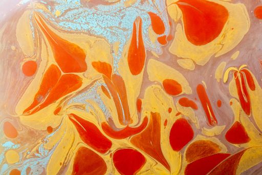 A closeup shot of an abstract painting made of orange and yellow colors