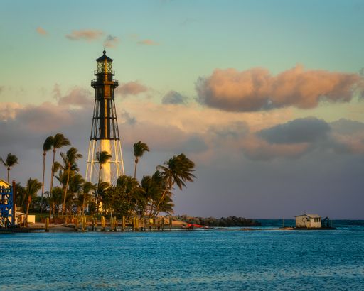A beautiful scene of the Hillsboro Lighthouse in Hillsboro Beach, Florida against gray cloudy sky