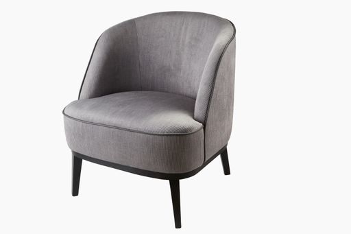 A gray, soft tub chair isolated on a white background