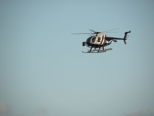 a close up shot of a black helicopter.