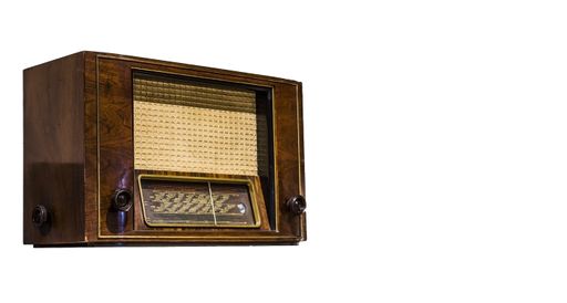 A closeup shot of an old radio isolated on a white background