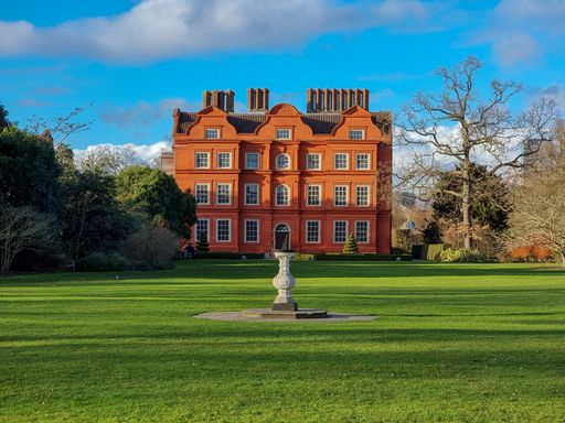 A symmetric shot of the beautiful green garden in front of the royal Kew Palace, Richmond, UK