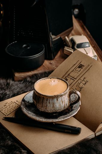 A vertical shot of coffee with vintage objects