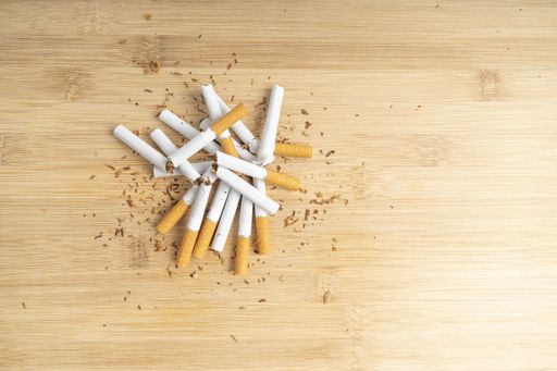 Top view of broken cigarettes on a wooden board. International No Tobacco Day